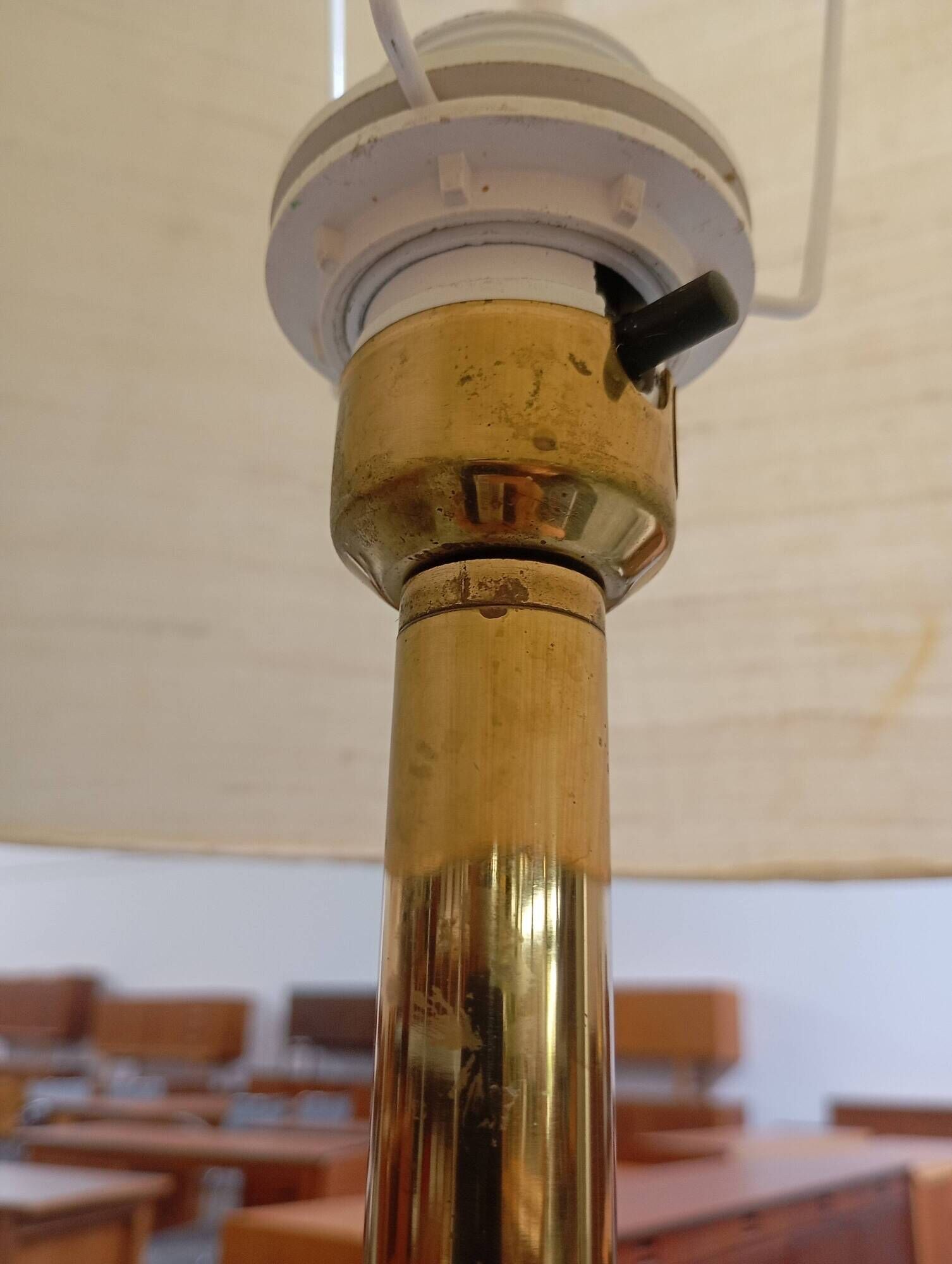 Vintage floor lamp with a gold base.