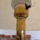 Vintage floor lamp with a gold base.