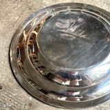 Round, hollow silver-plated metal dish