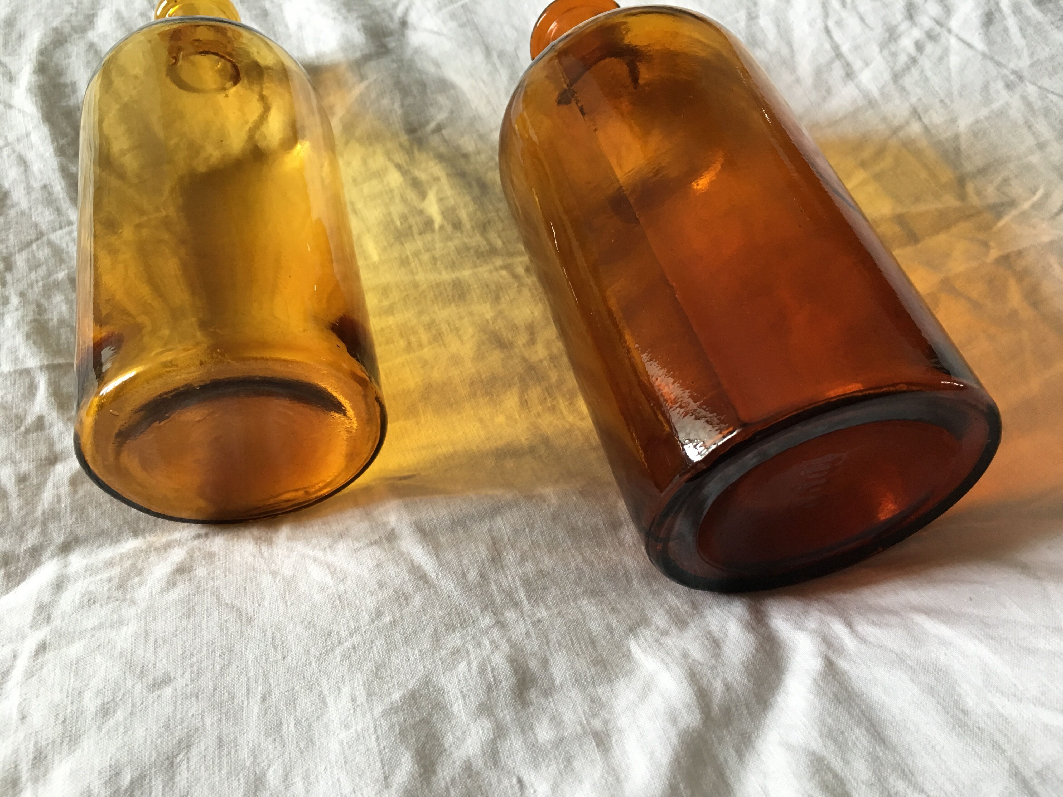 Duo of amber apothecary bottles