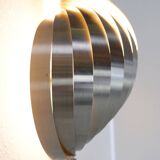 Swelling aluminum sconce by Henri Mathieu - 1970s
