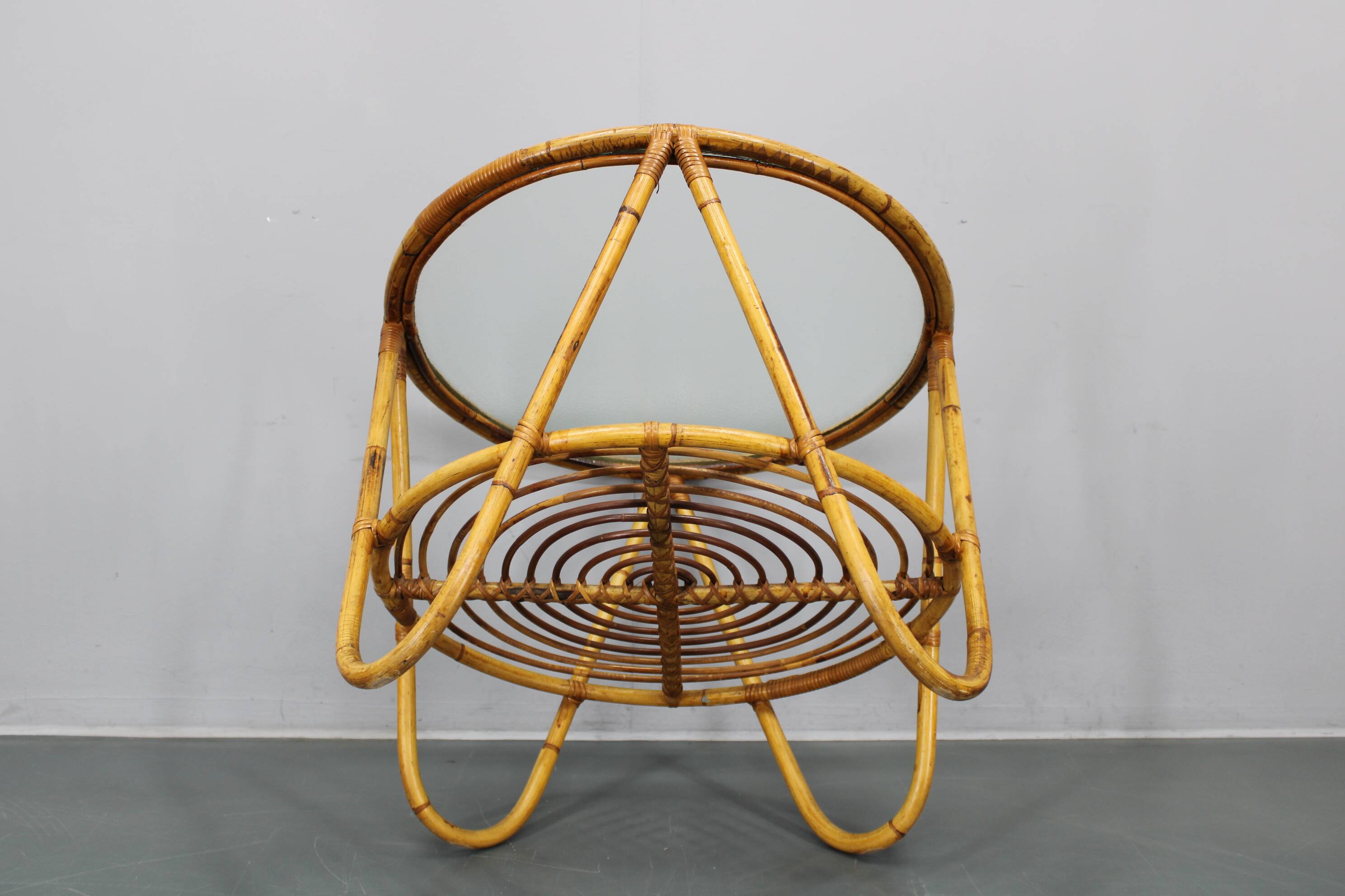 1960s Italian rattan coffee table with glass top, mid-century round design