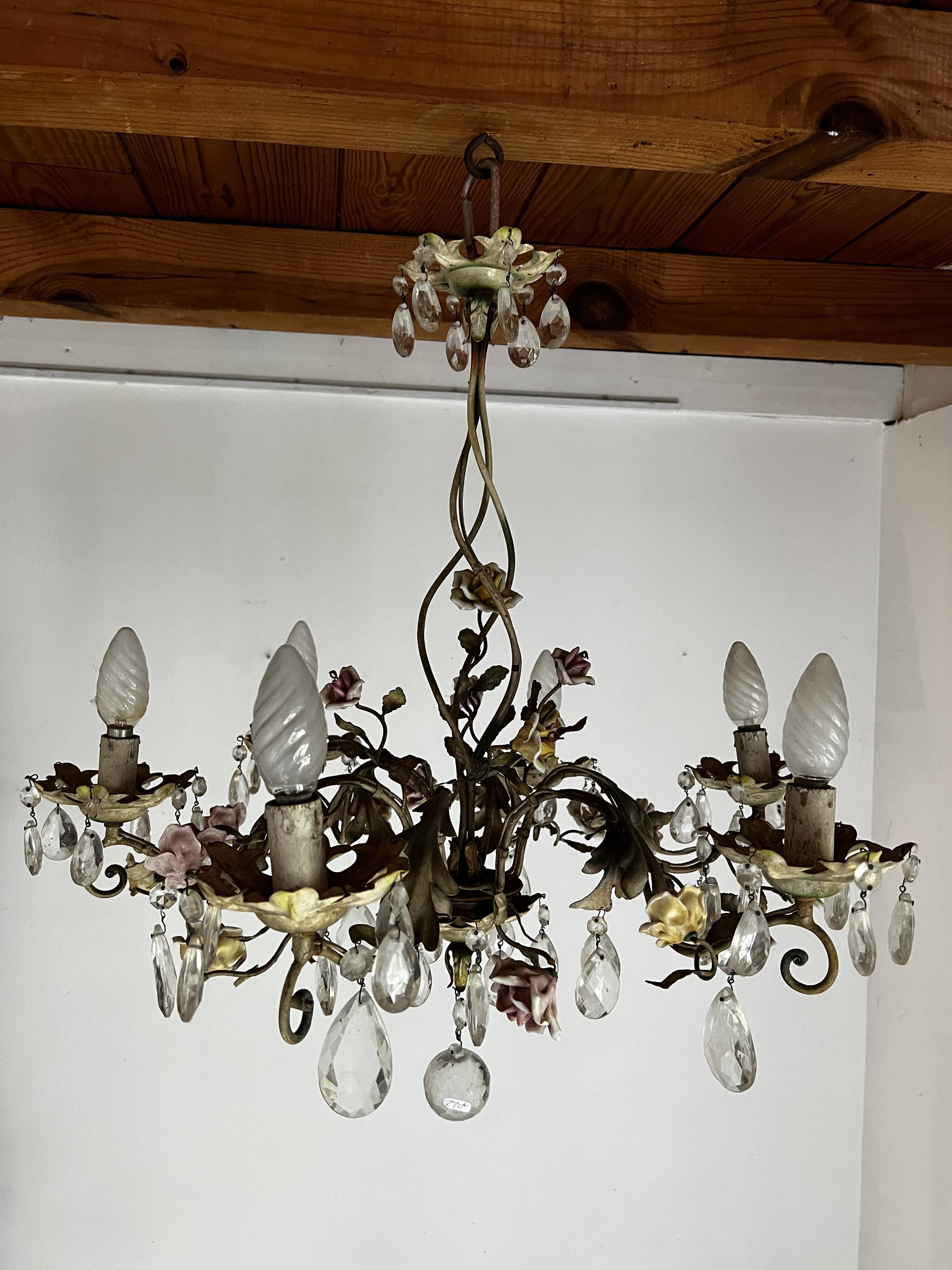 Chandelier with a floral porcelain decoration and pendants
