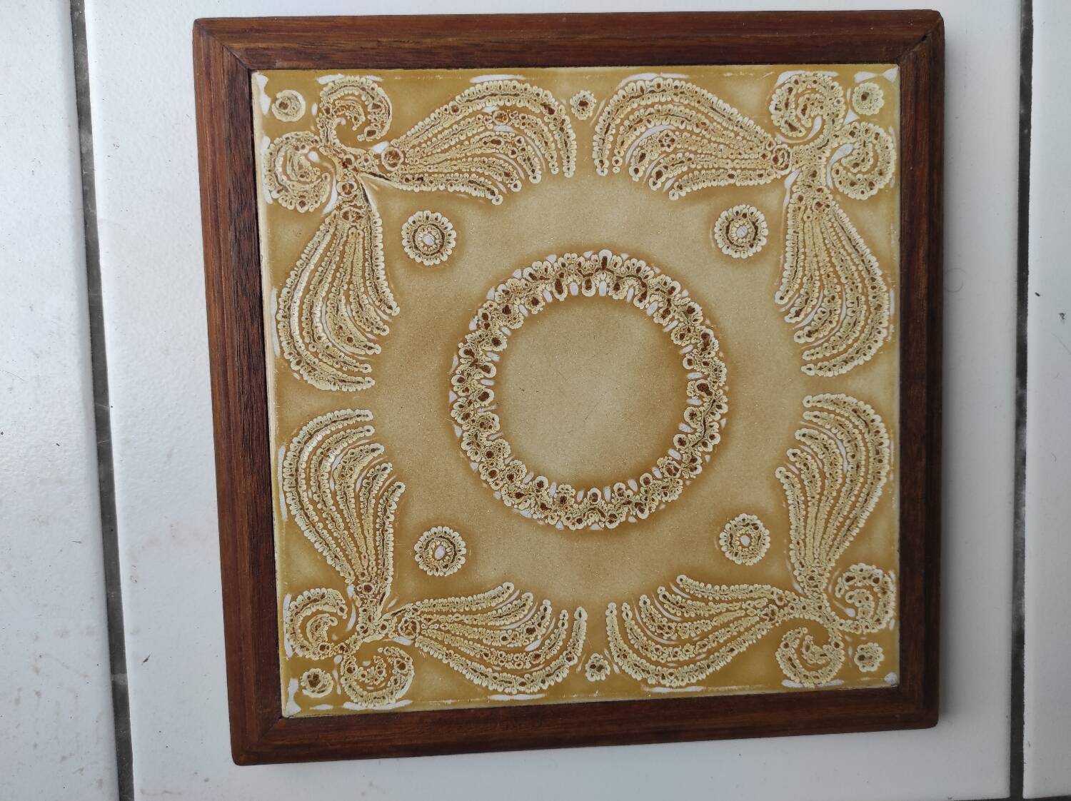 Wooden and ceramic trivet