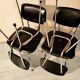 4 vintage chairs in black skai