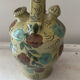 Mediterranean ceramic jug with floral decoration.