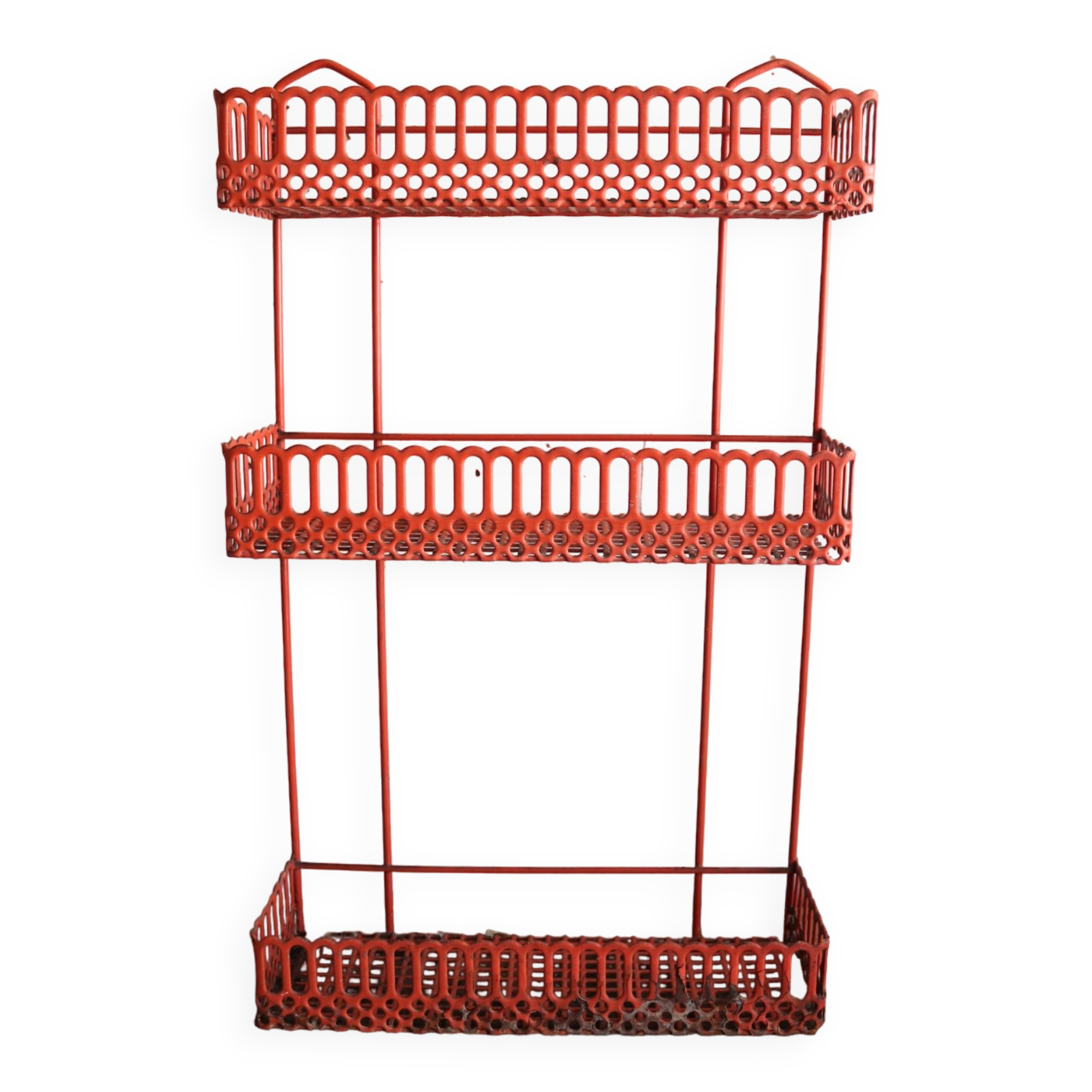 Vintage shelf in red openwork metal