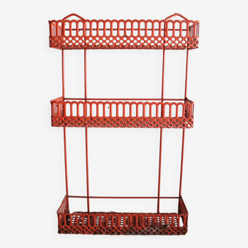 Vintage shelf in red openwork metal