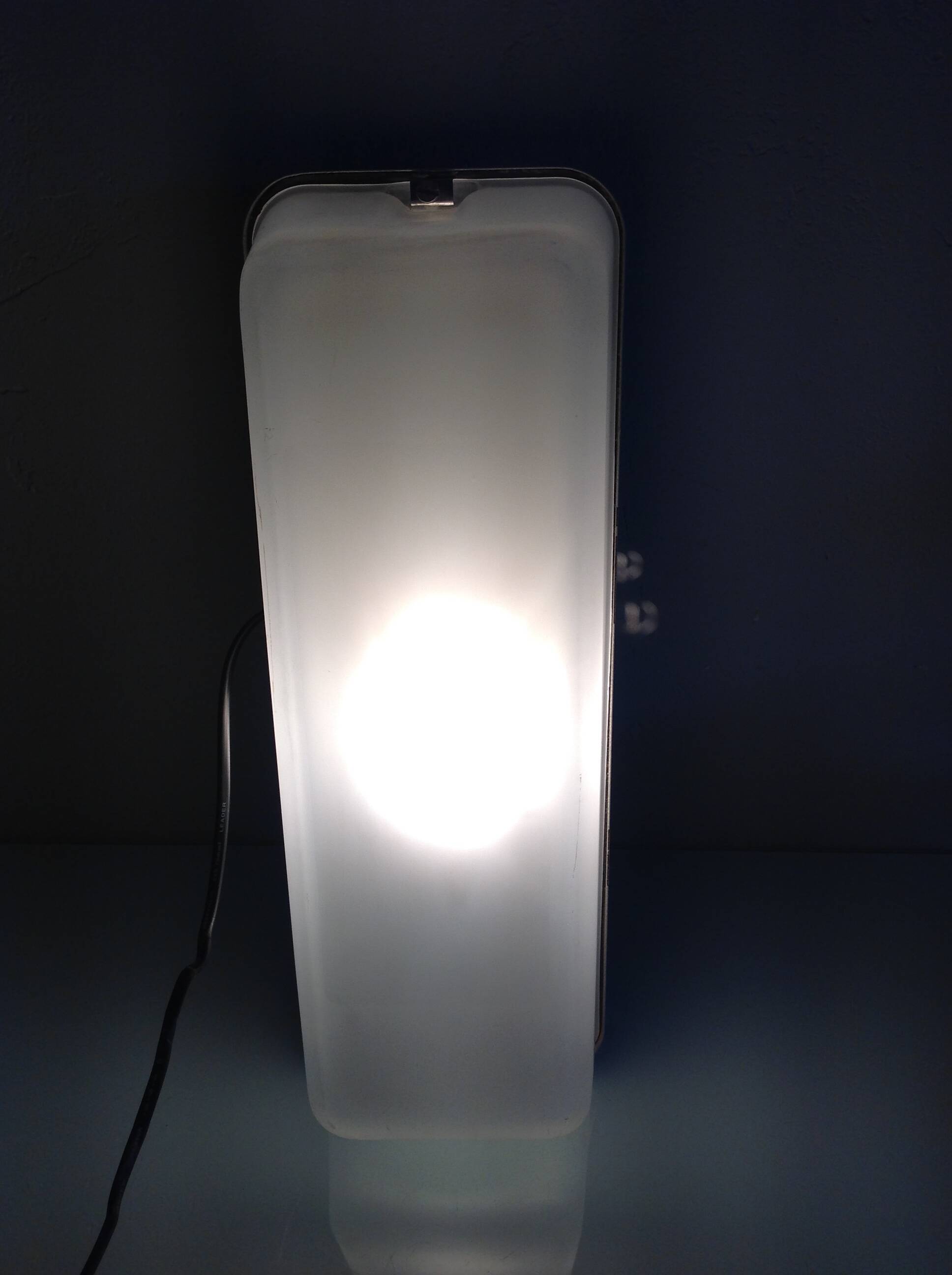 Rectangular porthole wall light in industrial/70s style frosted glass