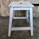 Vintage white wood milking stool
