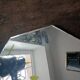 Three beveled mirrors