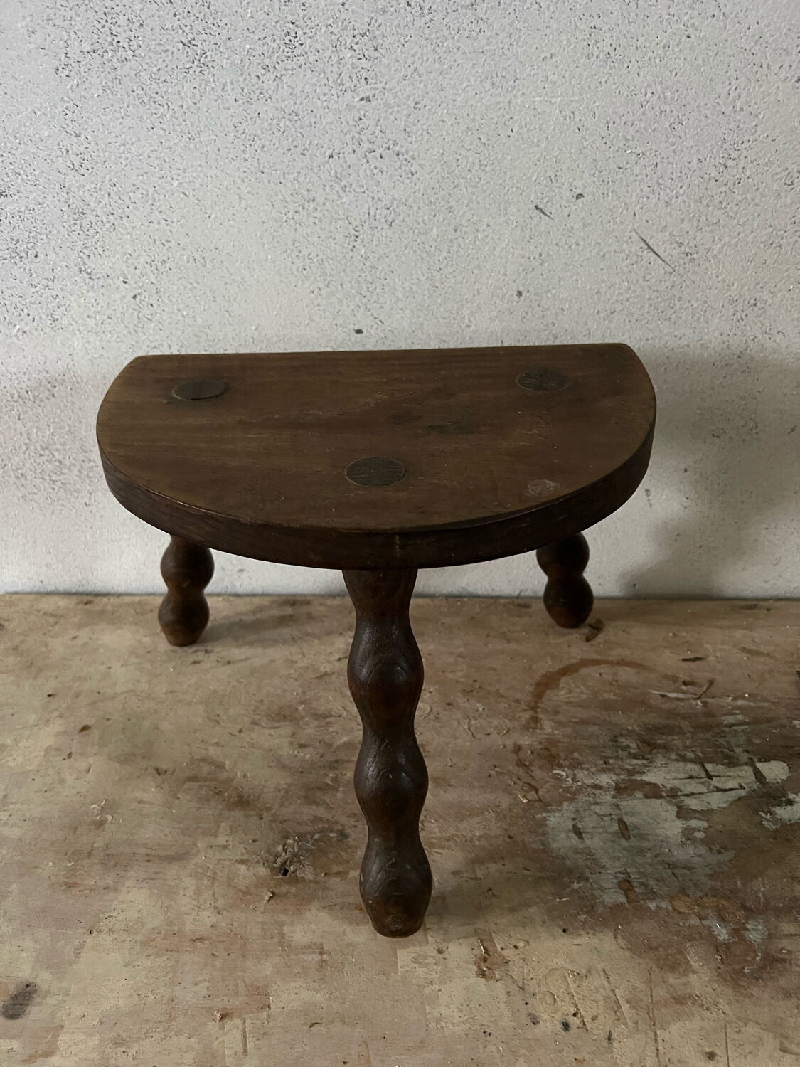 Wooden tripod farm stool