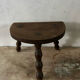 Wooden tripod farm stool