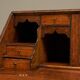 Antique English oak secretary with drop-down front.
