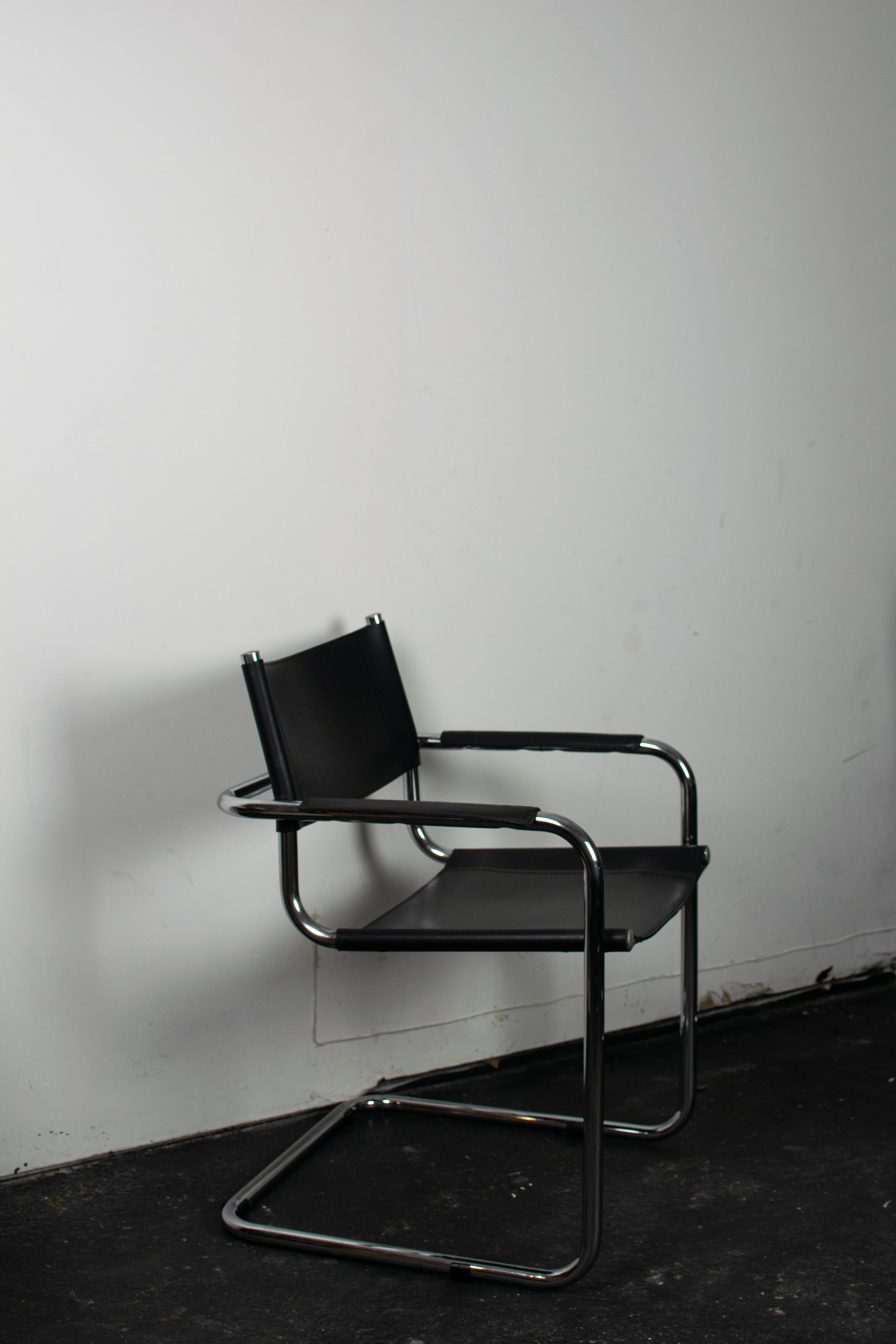 Black leather cantilever armchair 70s-80s