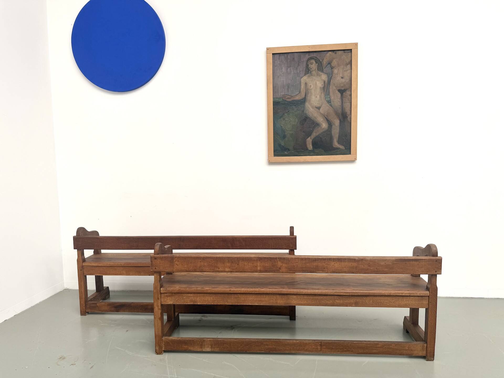 Pair of communal benches in solid oak, 1950s.