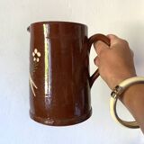 Terracotta pitcher with hand-painted bird decor