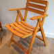 Paire de fauteuils pliants en bois vernis signé Clairitex
