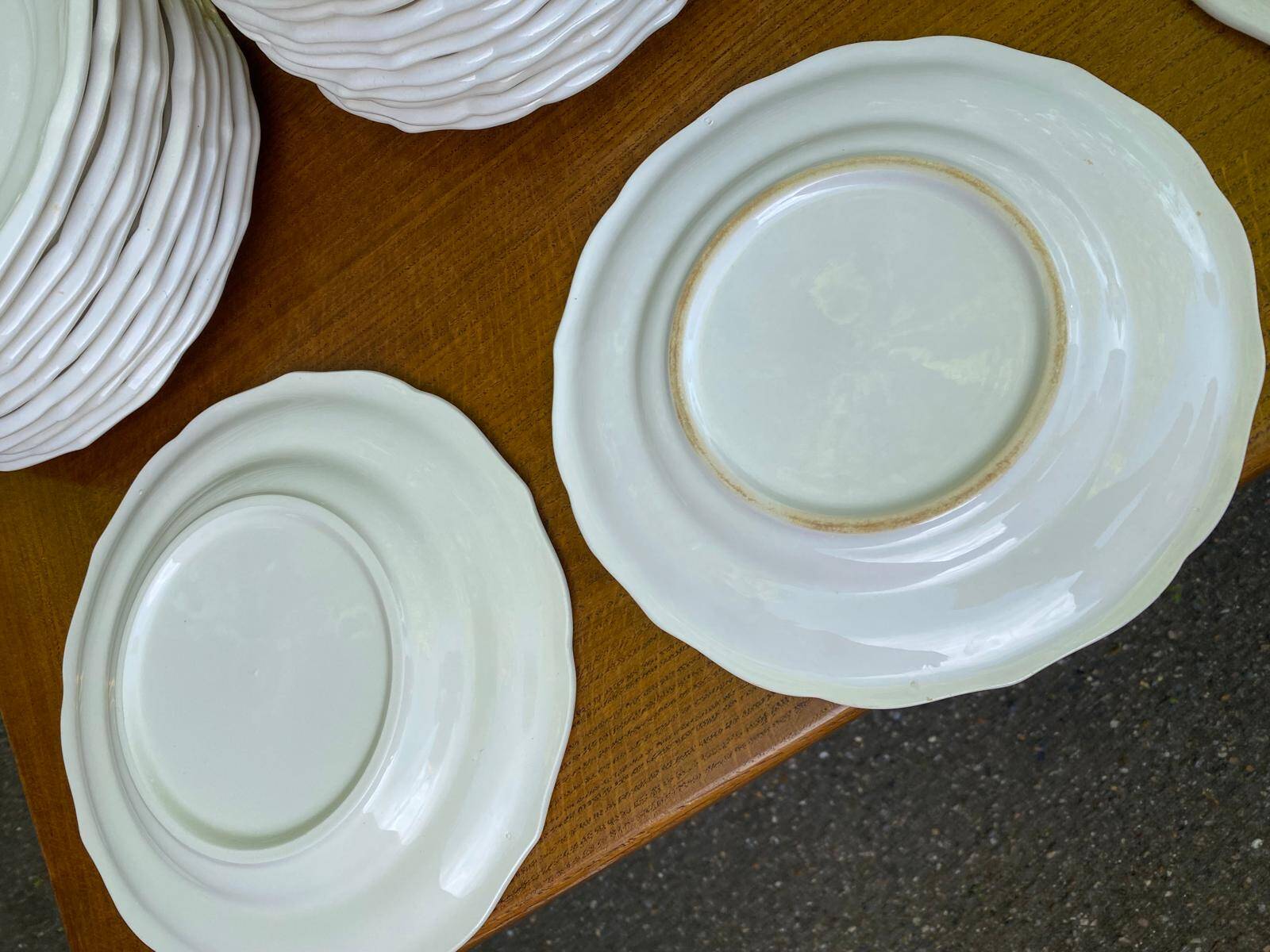 Service of 84 vintage white porcelain plates.