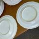 Service of 84 vintage white porcelain plates.