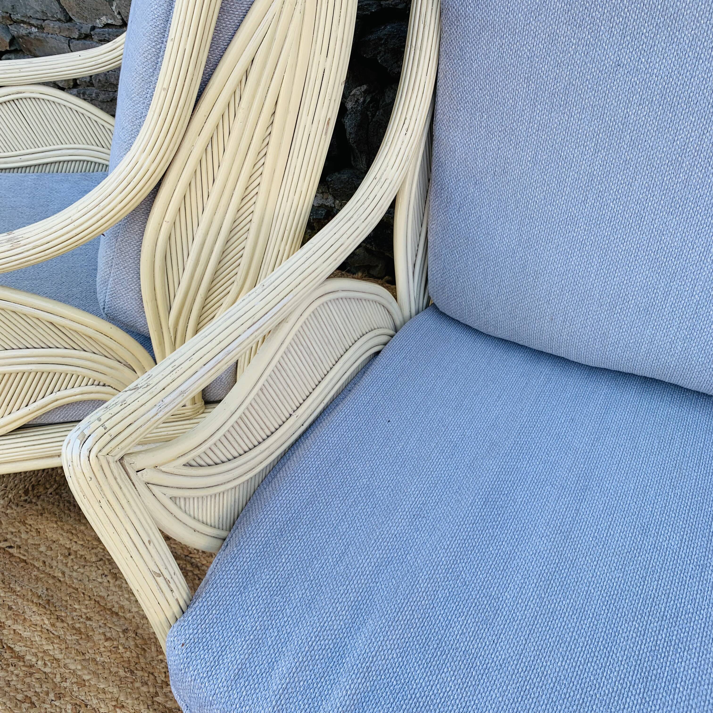 Pair of white rattan armchairs