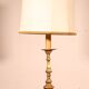 bronze candlestick from the 18th century converted into a lamp with its shade