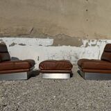 2 armchairs and 1 ottoman in brushed aluminium and brown leather, France, 1970.