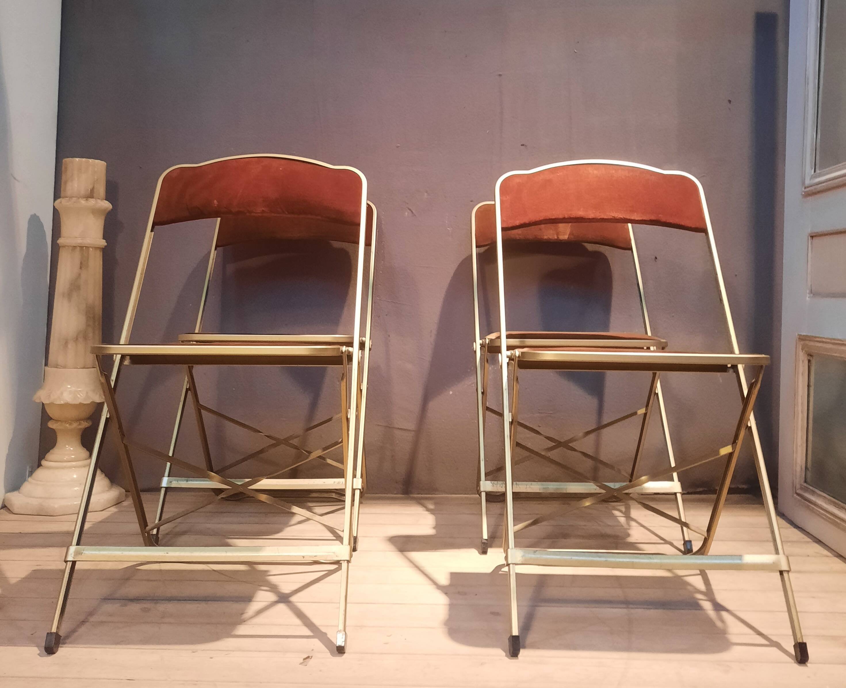 Set of four folding metal and velvet chairs