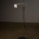 Adjustable perforated shade floor lamp