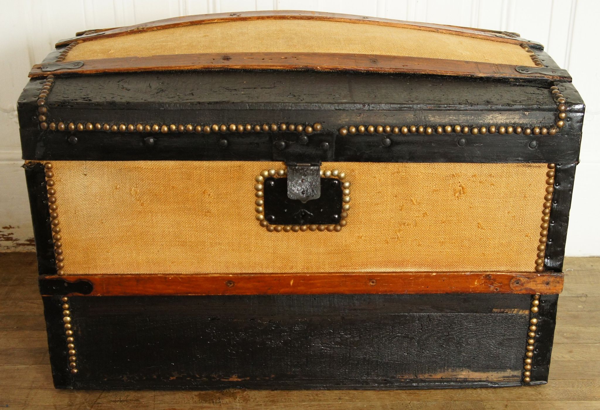 Old-curved wooden trunk - burlap