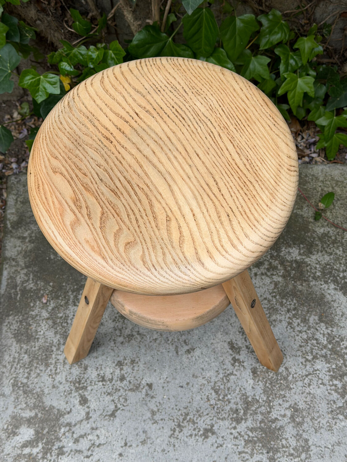 1950s solid oak tripod workshop stool with a screw mechanism.