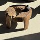 Small low circular four-legged stool in organic old teak with cut-out design H2