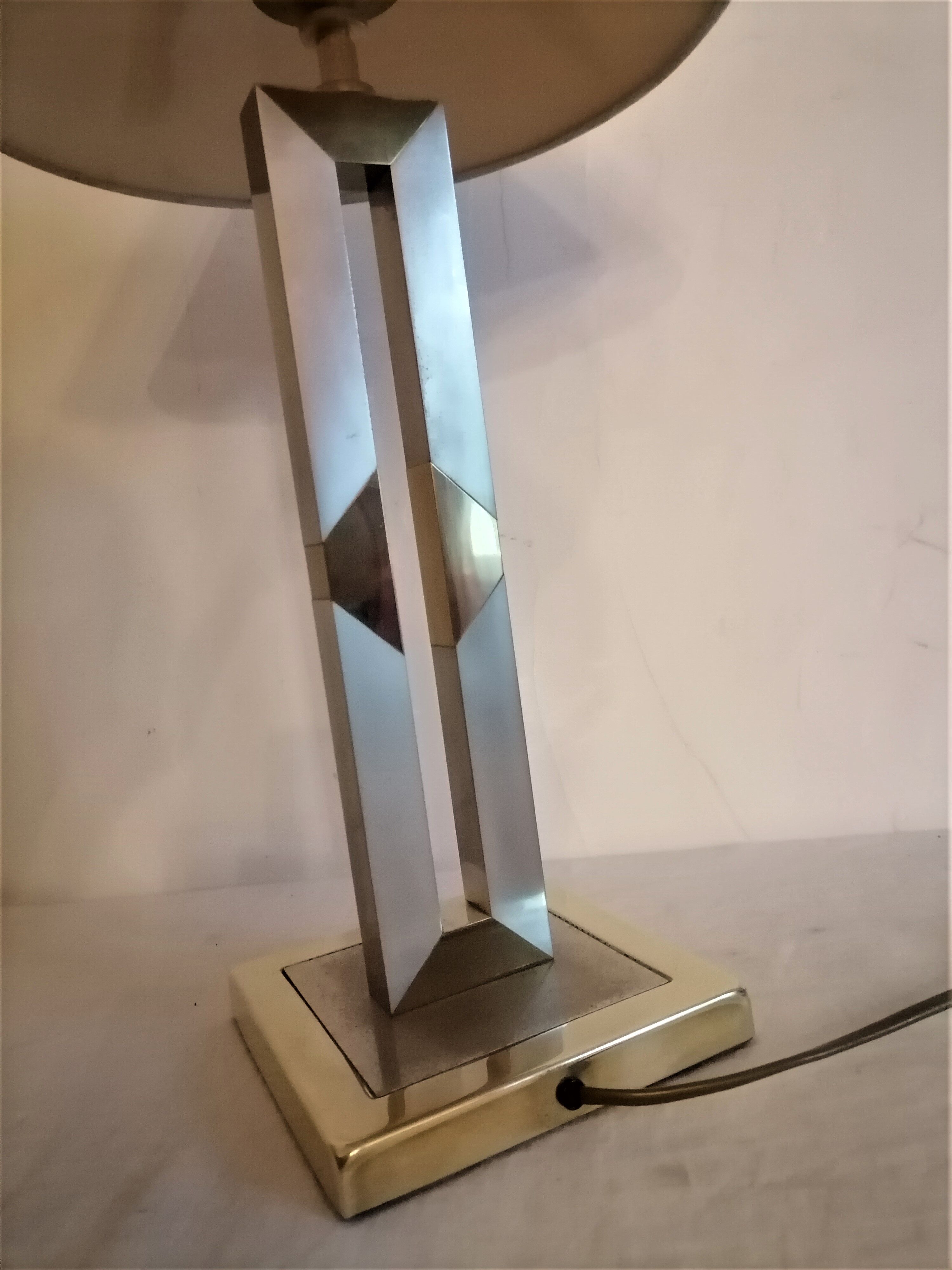 Modernist lamp. Brushed steel and brass.