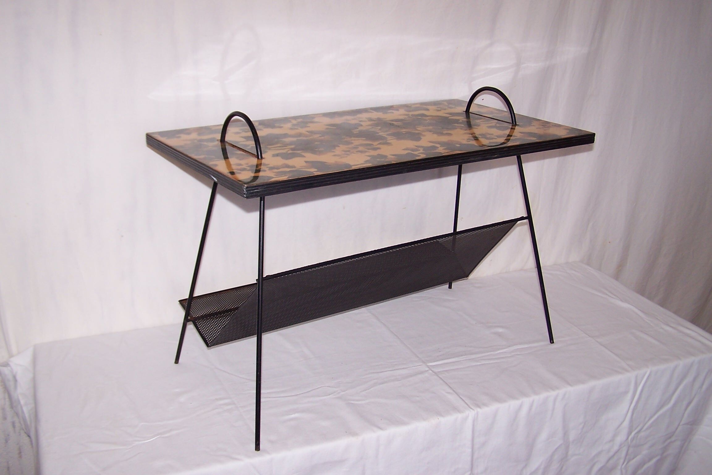 Perforated plate coffee table from the 1950s