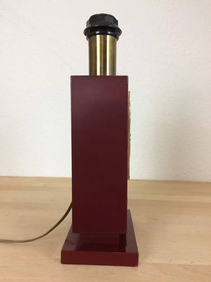 1980s vintage lamp base in red wood and gold metal.