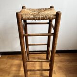 Low wooden and straw stool