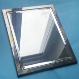 Faceted modernist wall mirror in steel and brass, geometric mixed metal frame 1970s.