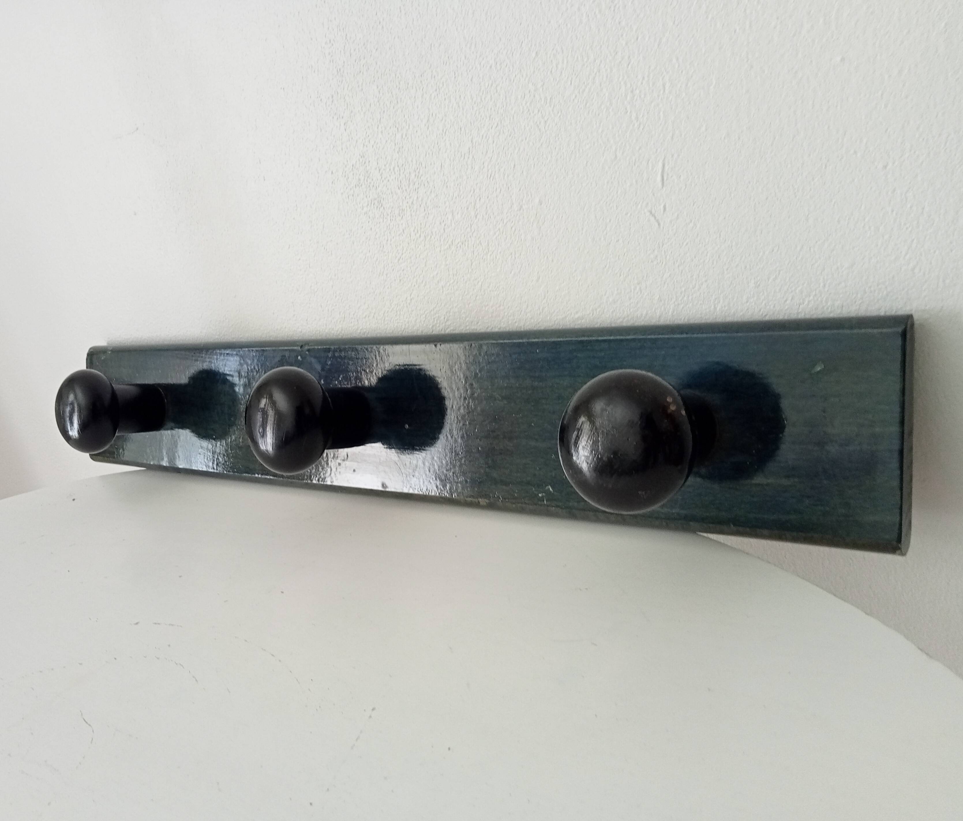Vintage wall-mounted coat rack in lacquered wood from the 60s