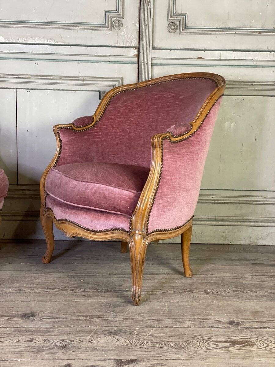 Pair of Louis XV style bergère armchairs in carved wood, pink velvet, circa 1900