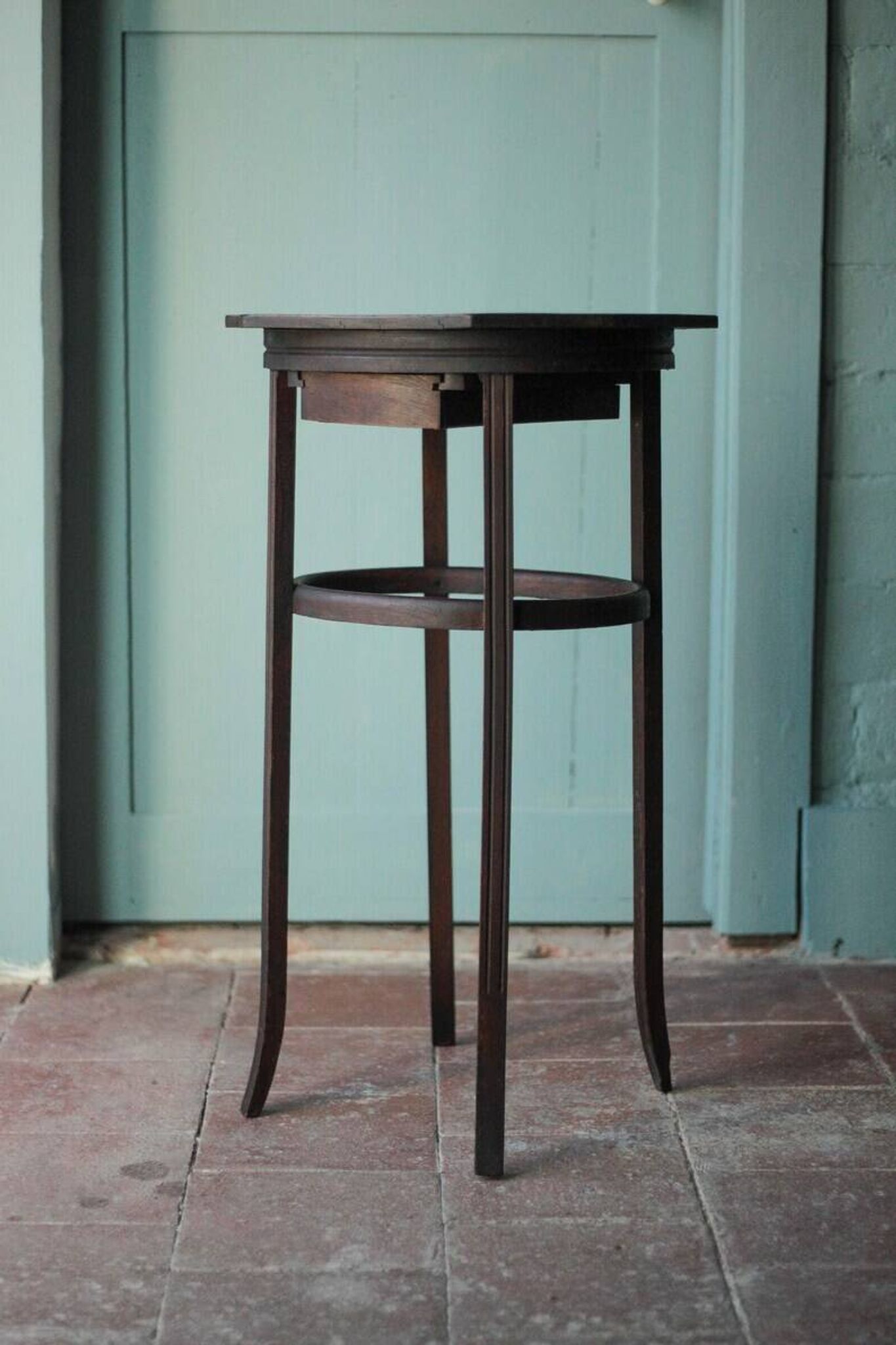 Wooden drawer table or 19th-century work table with a curved wooden stretcher, in the style of Thonet, circa 1900-1920.