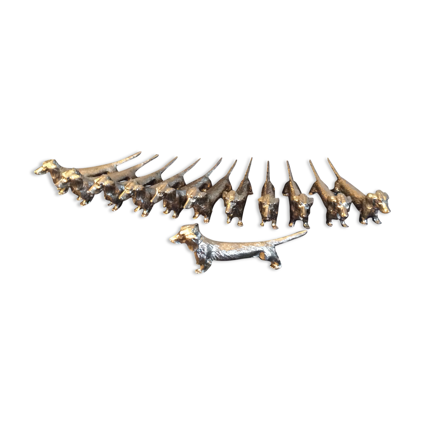 Series of 12 vintage dachshund knife holders in silver metal