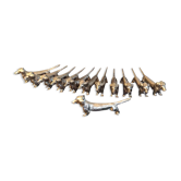 Series of 12 vintage dachshund knife holders in silver metal