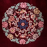 China wool fringed rug with floral pattern on deep plum background 393x274cm
