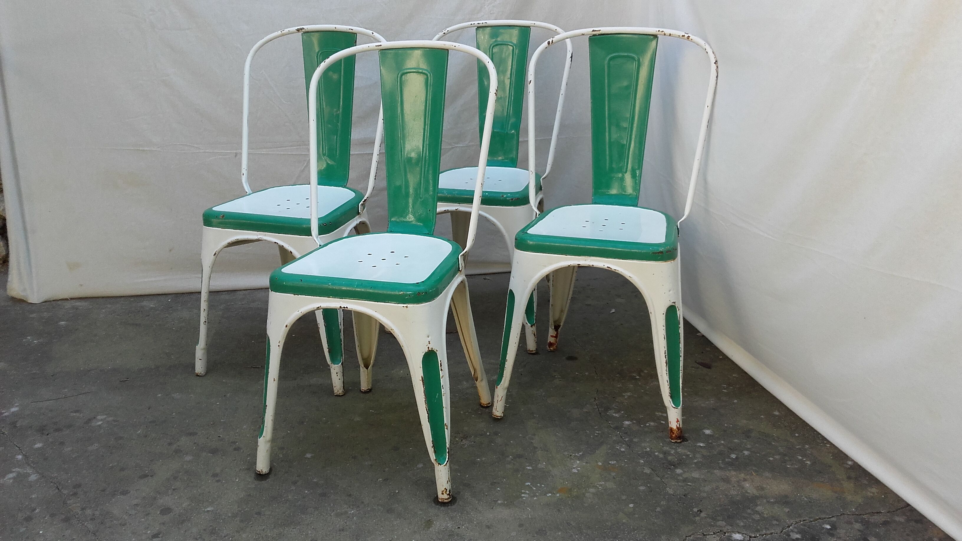 Four old Tolix Model A chairs