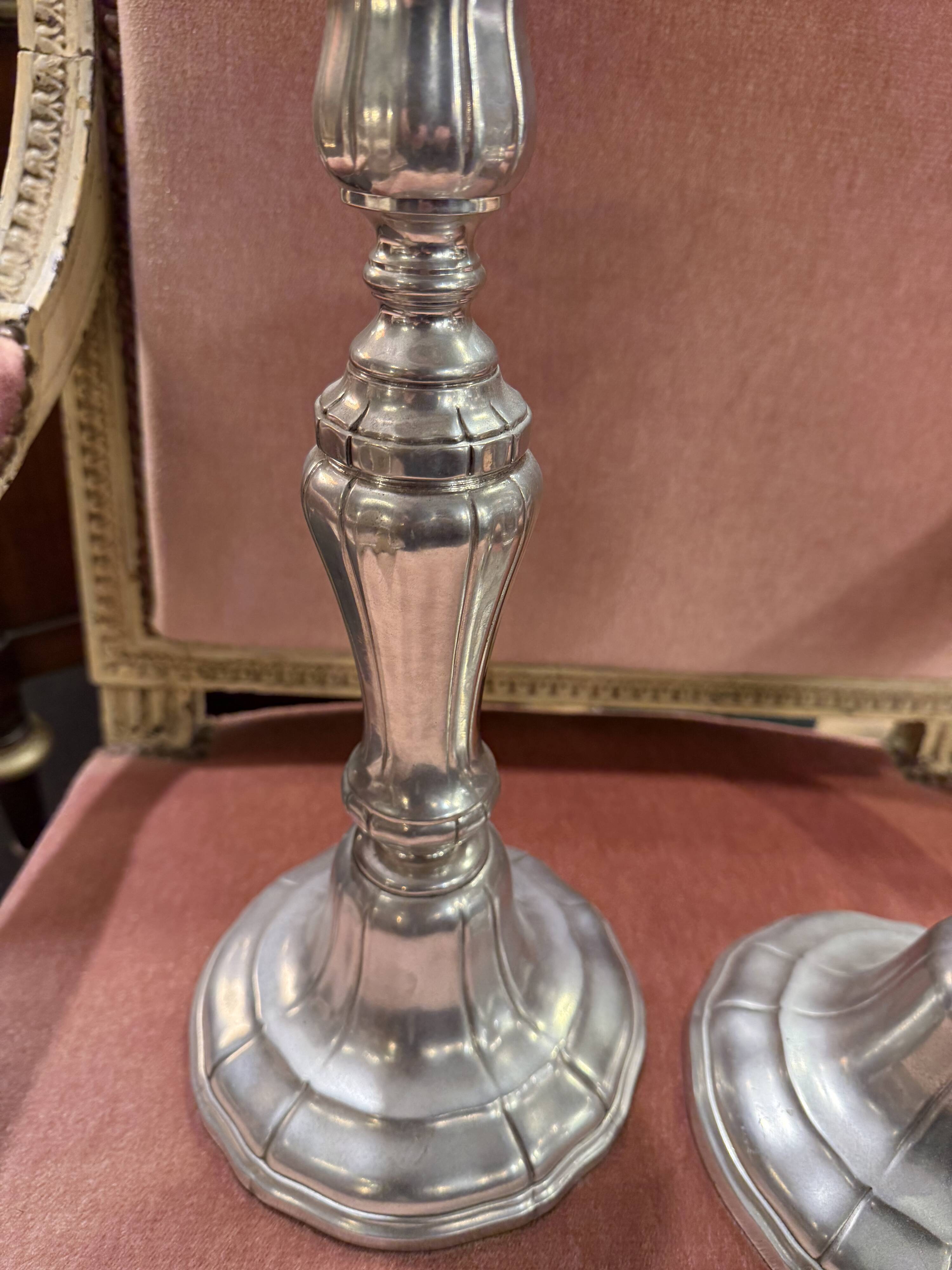 Pair of metal candlesticks