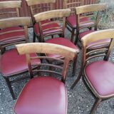 Set of 8 bistro chairs in vintage red wood and leatherette.