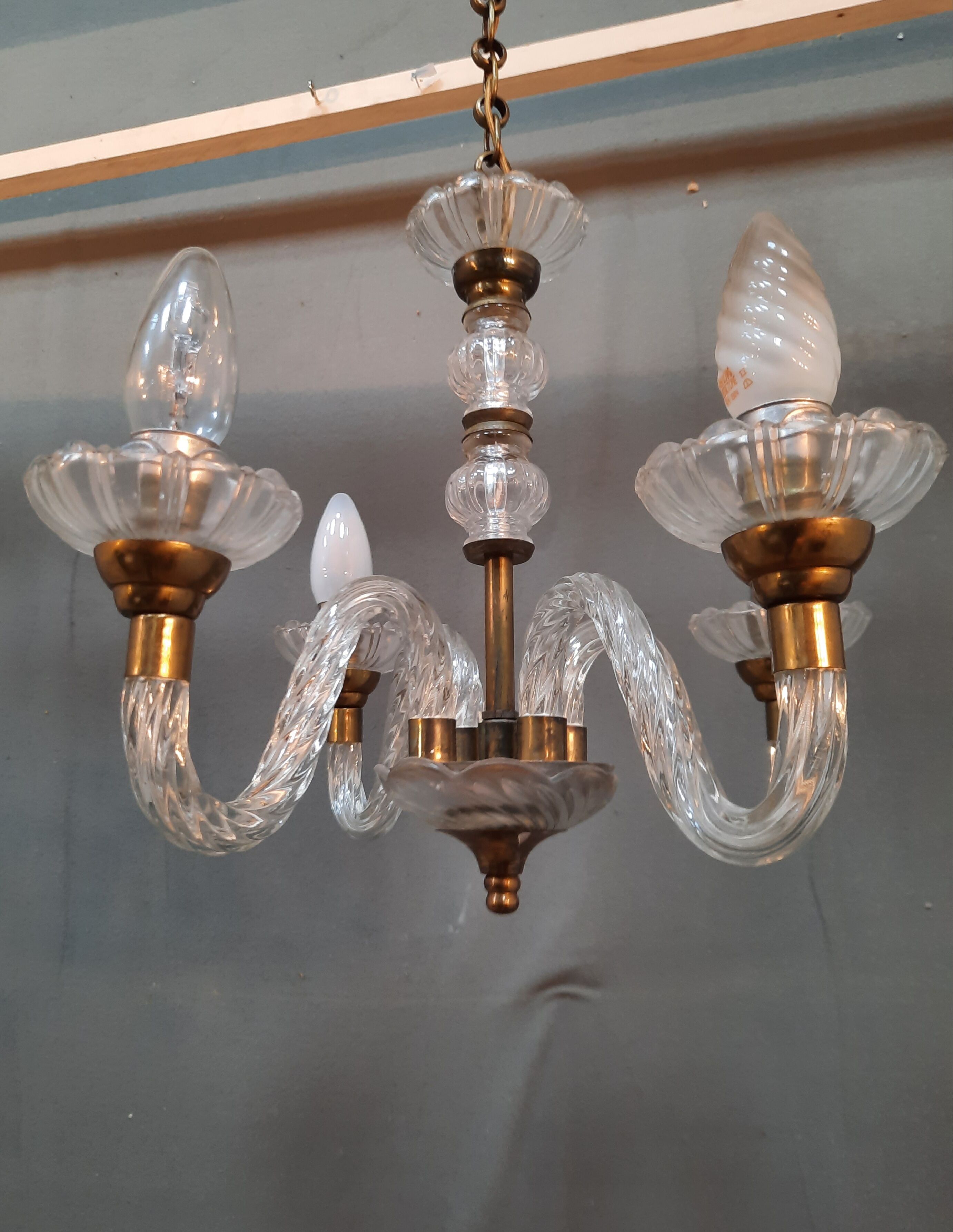 Glass chandelier has 4 lights