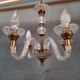Glass chandelier has 4 lights