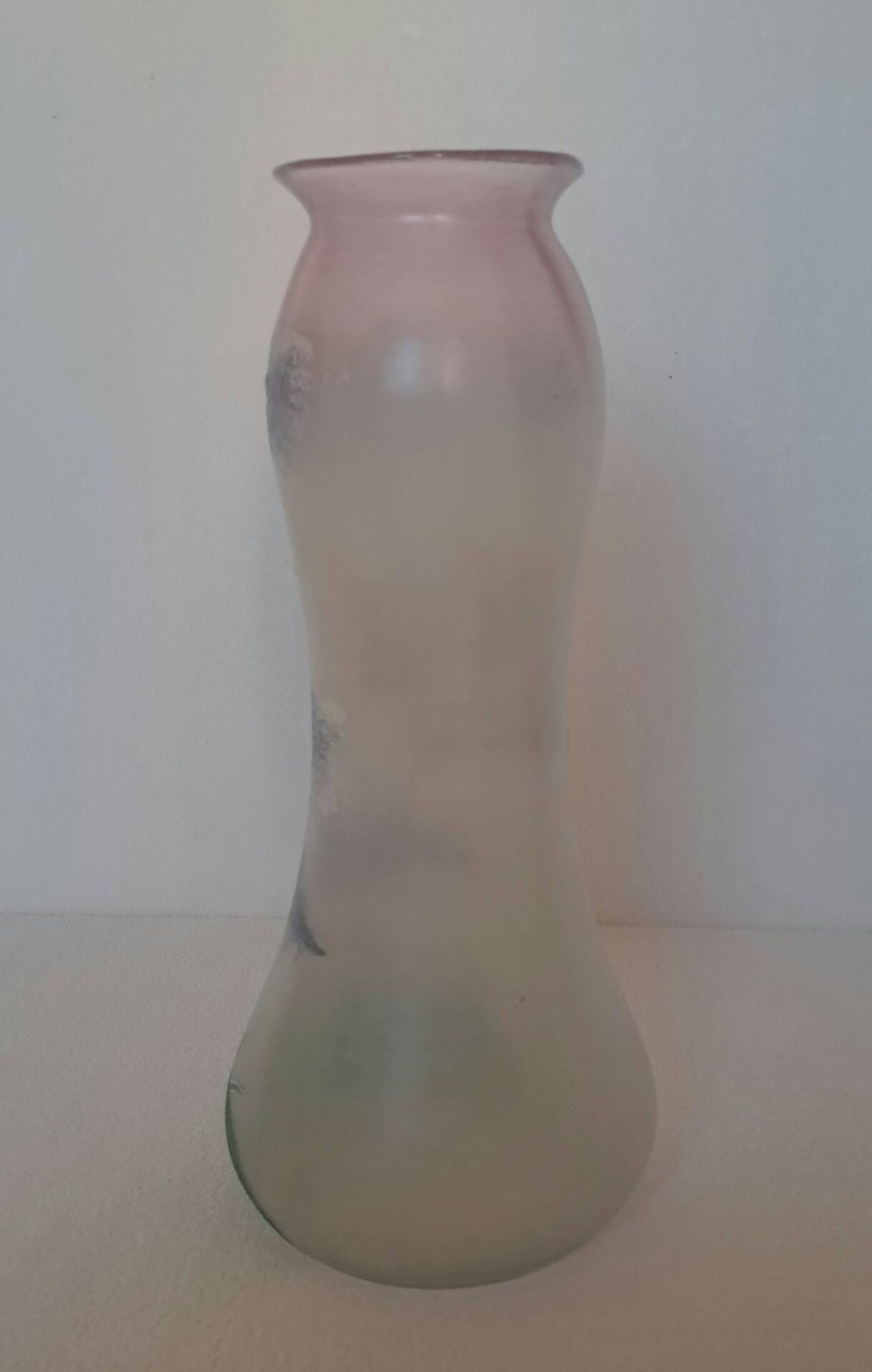 Frosted glass vase enhanced by hand