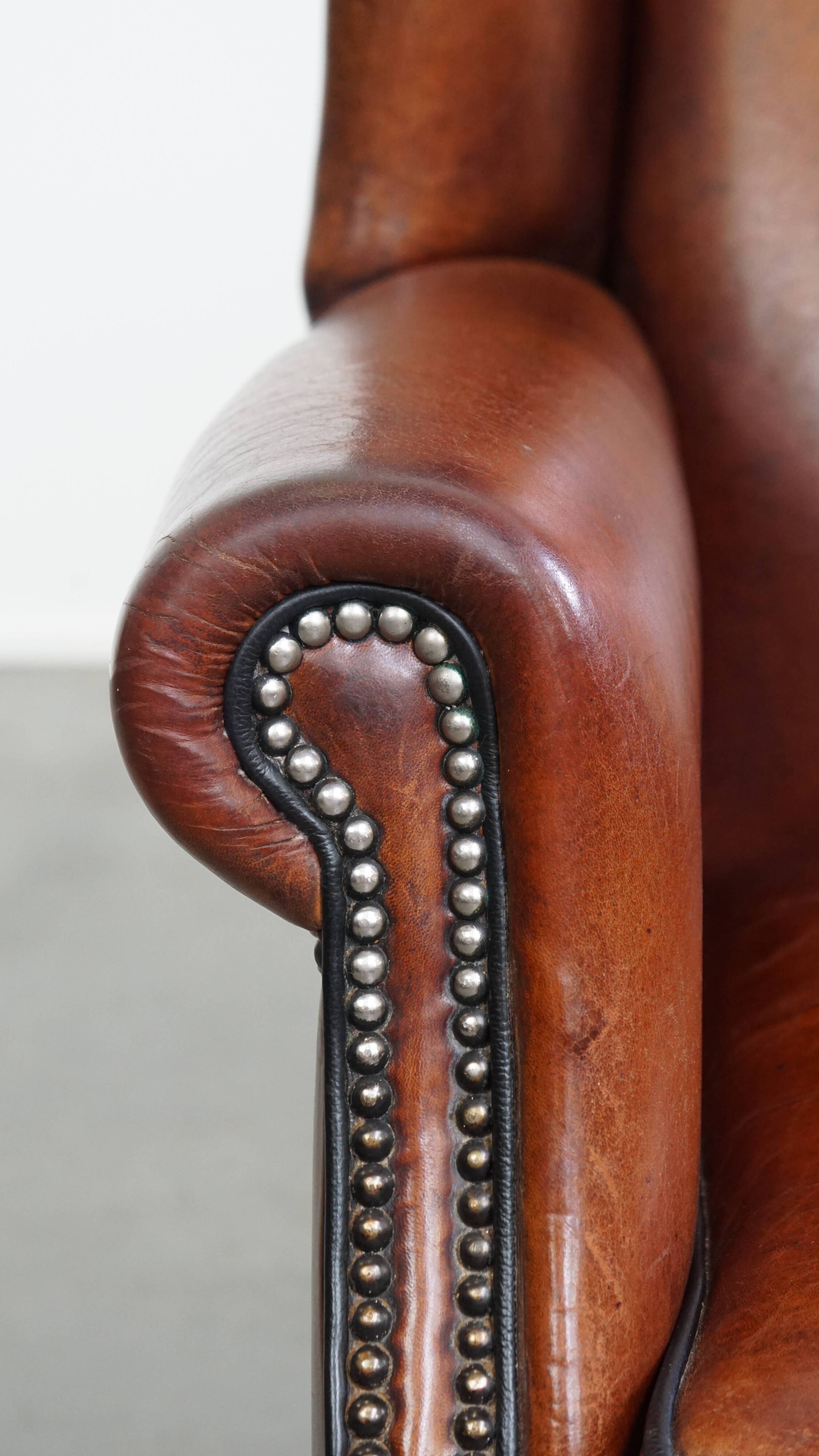 Sheepskin Wingback Chair with Warm Tones and Black Piping